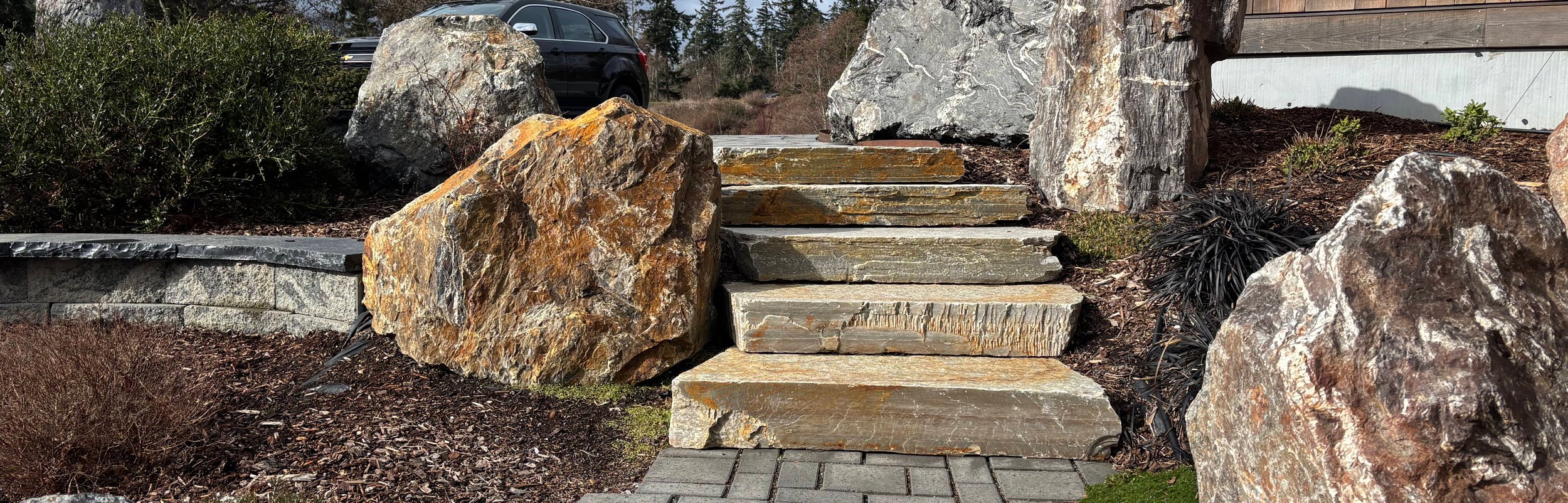 Natural stone steps and boulder landscaping on Whidbey Island