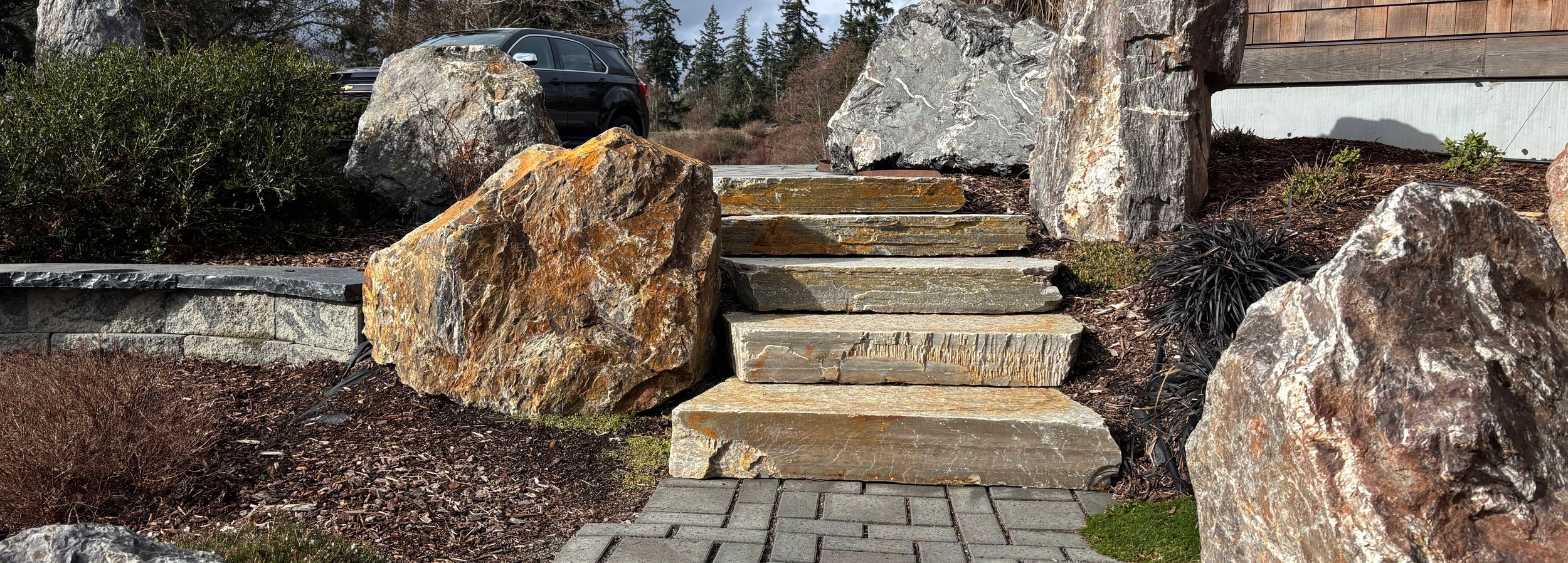 Natural stone steps and boulder landscaping on Whidbey Island