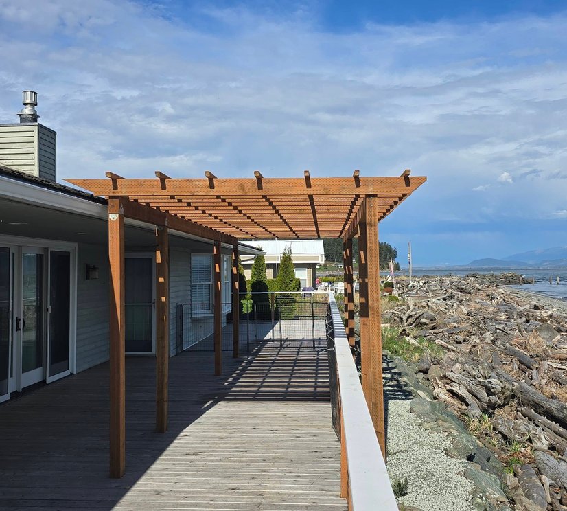 Waterfront deck with a cedar pergola on Whidbey Island