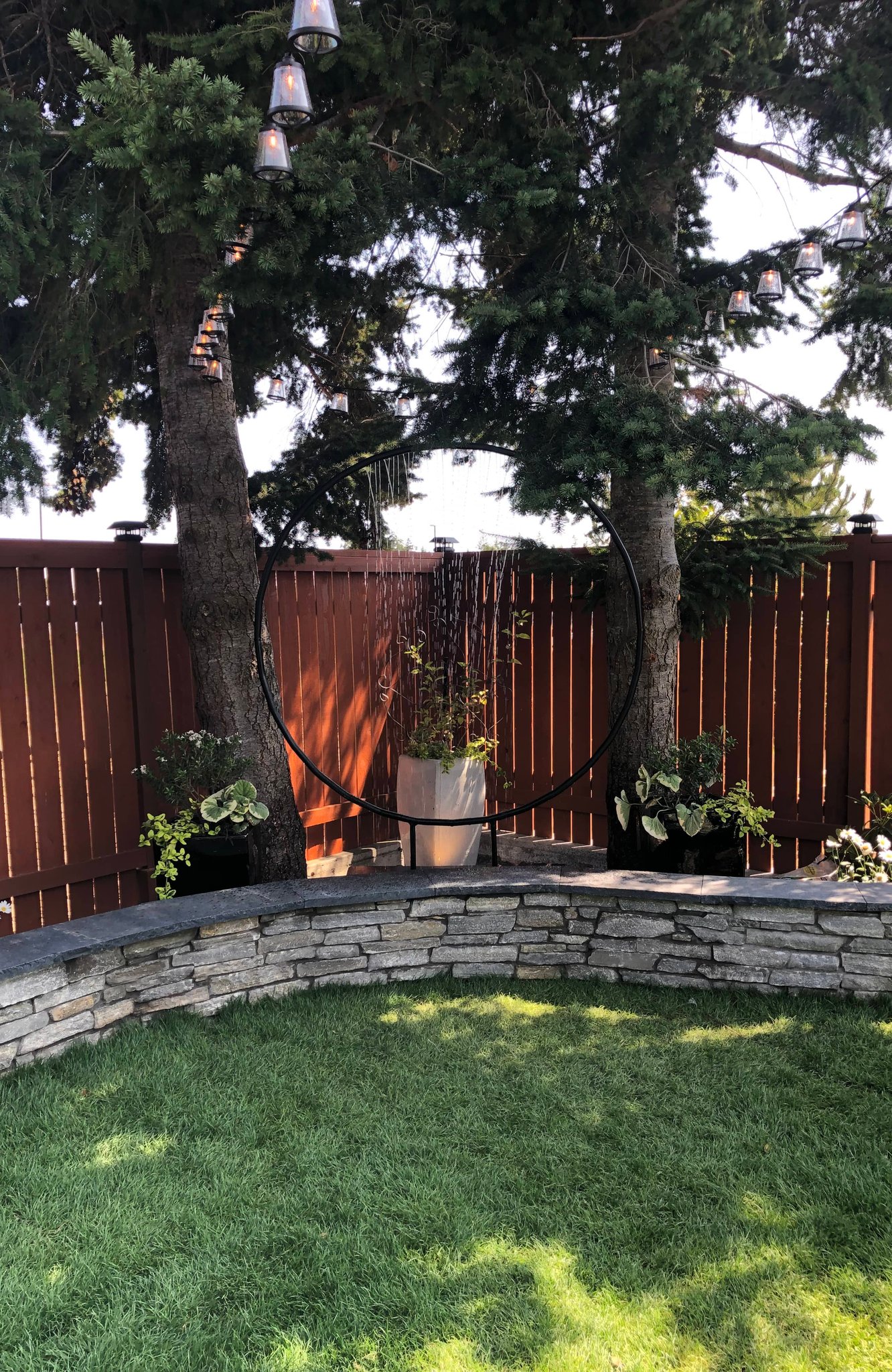 Backyard water feature and stone retaining wall in Oak Harbor